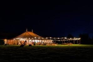Traditional Marquee with festoon lighting on uprights around the marquee