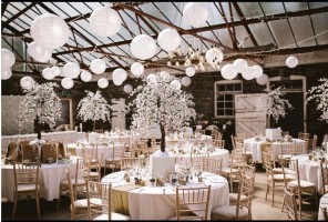 Paper Lanterns, round tables, lime washed chairs