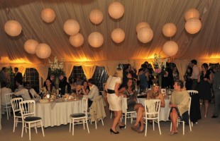 Paper Lanterns, Round Tables White Banqueting chairs.