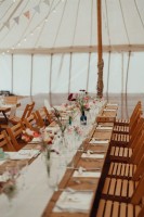 Banqueting tables in traditional marquee